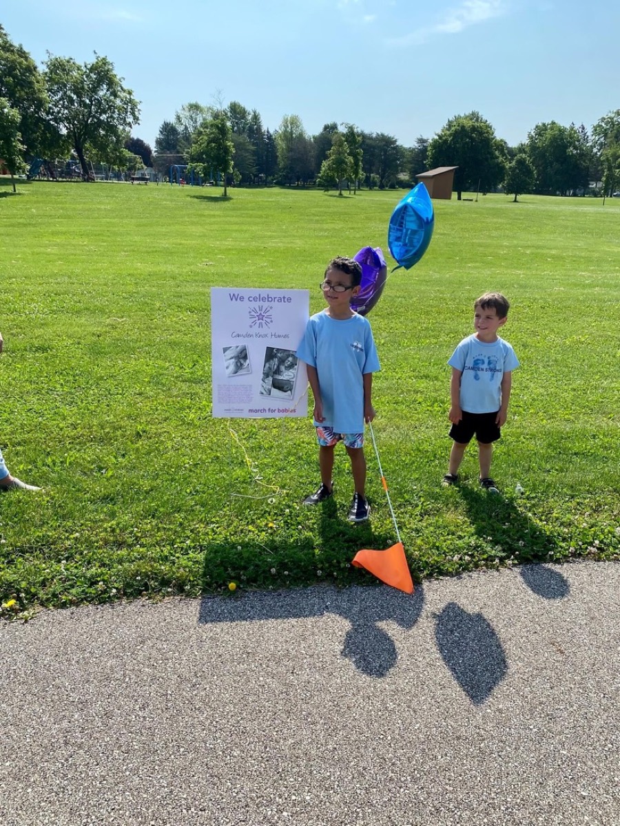 Two boys holding balloons at the March for Babies walk